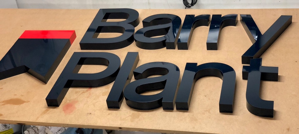 Fabricated and spray painted acrylic lettering